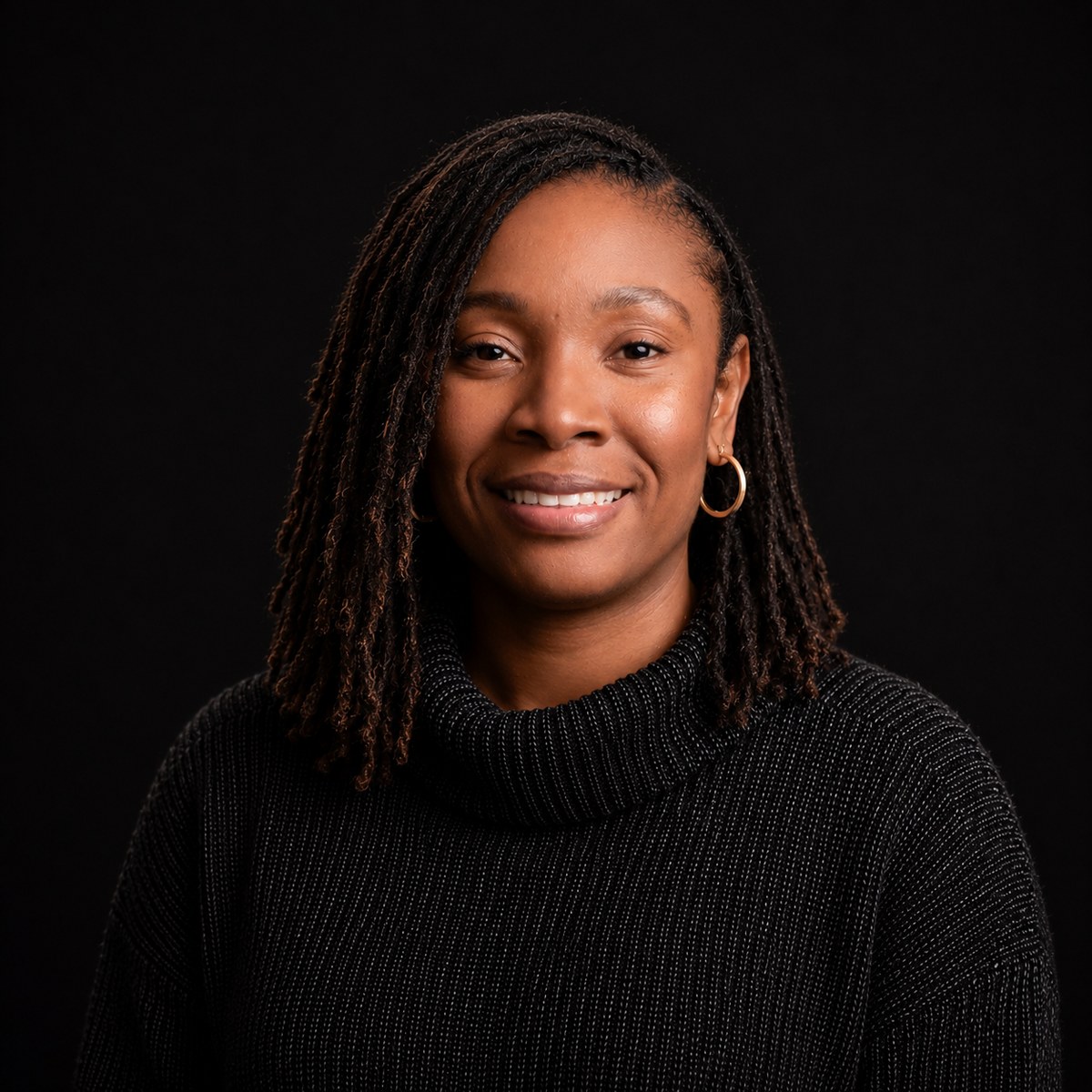Rodline Smith, MBA, founder of Smith Helping Hand, in a dark turtleneck sweater